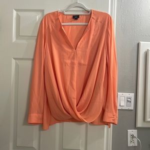 Beautiful bright peachy orange blouse.